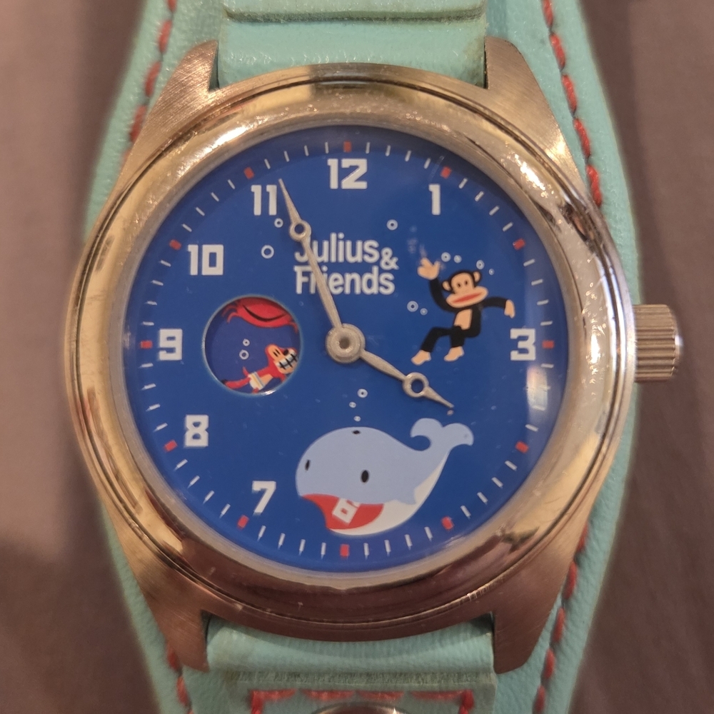 JULIUS & FRIENDS NON-FUNCTIONING WATCH - MAN MADE MATERIAL
